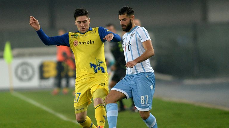 Ervin Zukanovic (L) of Chievo Verona competes with Antonio Candreva of SS Lazio