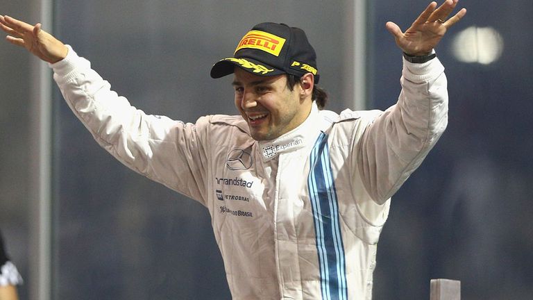 Felipe Massa celebrates on the podium after finishing second in Abu Dhabi