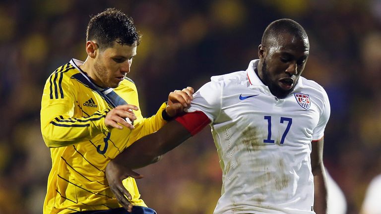 Jozy Altidore of the USA holds off Pedro Franco of Colombia during their International Friendly