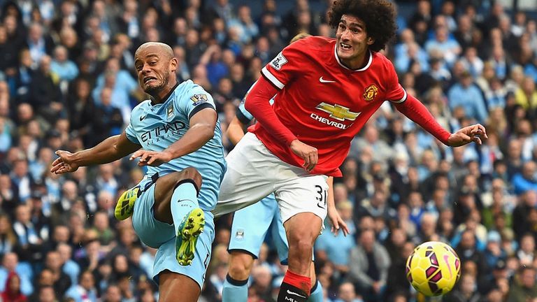 Vincent Kompany of Manchester City and Marouane Fellaini of Manchester United 