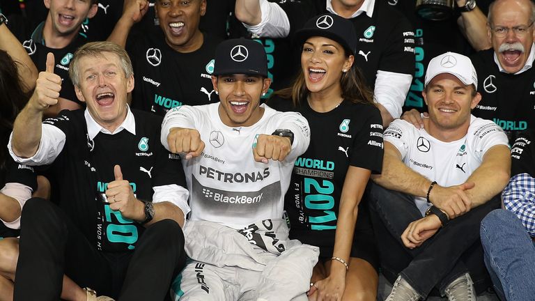 Lewis Hamilton celebrates with his girlfriend Nicole Scherzinger and Nico Rosberg