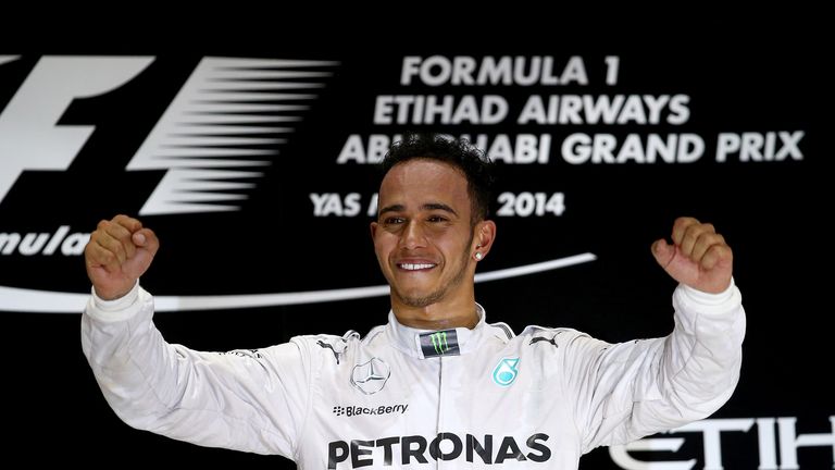 Lewis Hamilton celebrates on the podium 