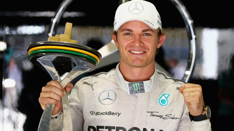 Nico Rosberg poses with the trophy after his victory