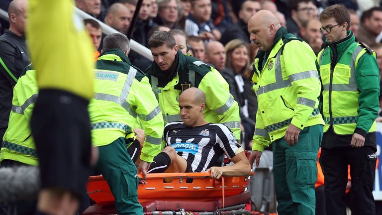 Gabriel Obertan is carried away after an injury during the Premier League match between Newcastle and Liverpool.