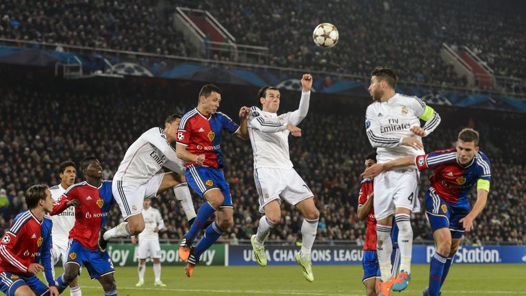 Real Madrid's Welsh forward Gareth Bale (C) tries to head the ball during his UEFA Champions League Group B football match between FC Basel and Real Madrid