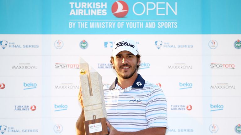 Koepka poses with the trophy after securing victory in the 2014 Turkish Airlines Open 