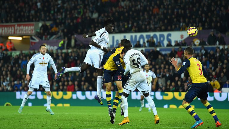 SWANSEA, WALES - NOVEMBER 09:  Swansea player Bafetimbi Gomis (c) heads the second Swansea goal during the Barclays Premier League match between Swansea Ci