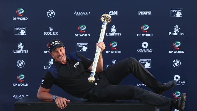 DUBAI, UNITED ARAB EMIRATES - NOVEMBER 23:  Henrik Stenson of Sweden poses with the trophy after winning the DP World Tour Championship at Jumeirah Golf Es