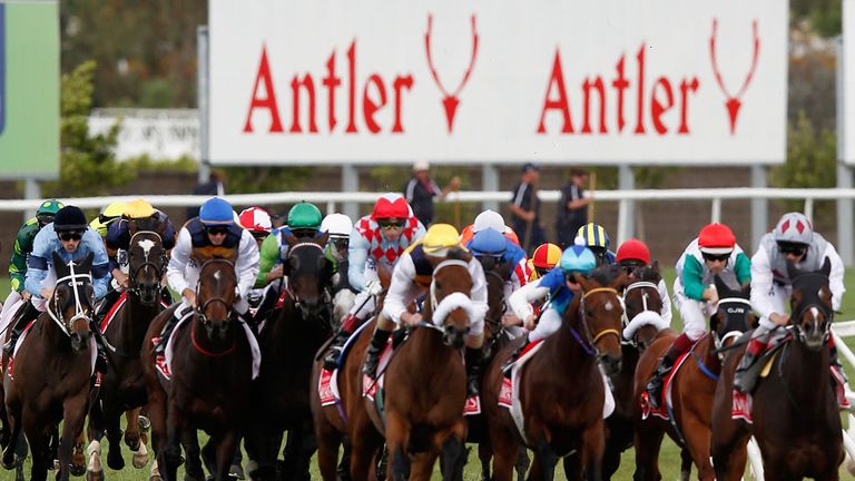 MELBOURNE, AUSTRALIA - NOVEMBER 04:  The field round the turn onto the home straight in the Emirates Melbourne Cup with My Ambivalent in front.