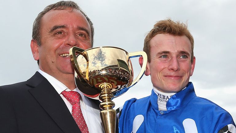 MELBOURNE, AUSTRALIA - NOVEMBER 04:  Trainer Andreas Wohler and Ryan Moore who rode Protectionist to win the Emirates Melbourne Cup pose with the trophy.