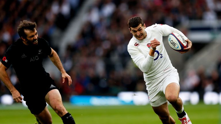 Jonny May of England breaks past Conrad Smith of New Zealand