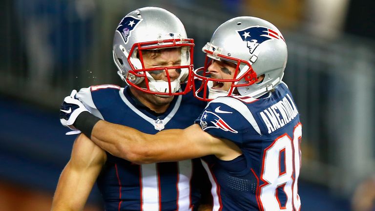 Julian Edelman and Danny Amendola of the New England Patriots react after a touchdown against the Denver Broncos