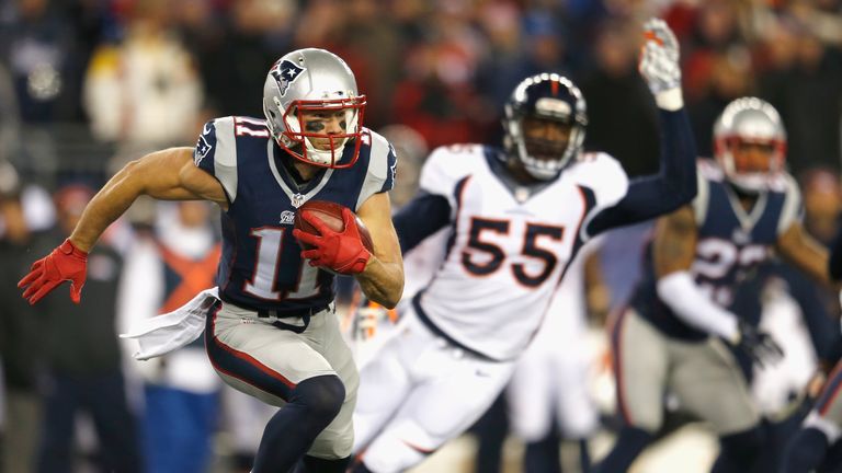 Julian Edelman of the New England Patriots returns a kick for a touchdown during the second quarter against the Denver Broncos