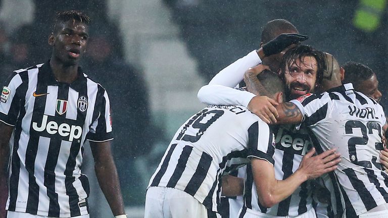 Juventus' midfielder Andrea Pirlo (C) celebrates with teammates after scoring during the Italian Serie A football match Juventus Vs Torino