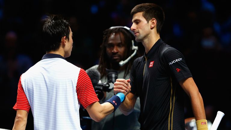LONDON, ENGLAND - NOVEMBER 15:  Kei Nishikori of Japan shakes hands with Novak Djokovic of Serbia after the singles semi-final match on day seven of the Ba