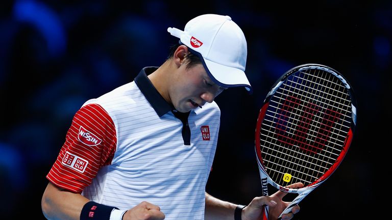 LONDON, ENGLAND - NOVEMBER 09:  Kei Nishikori of Japan celebrates winning a game in his match against Andy Murray of Great Britain in the round robin durin