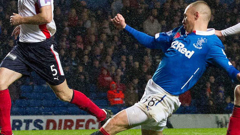 Kenny Miller slides home goal No 3 for Rangers at Ibrox
