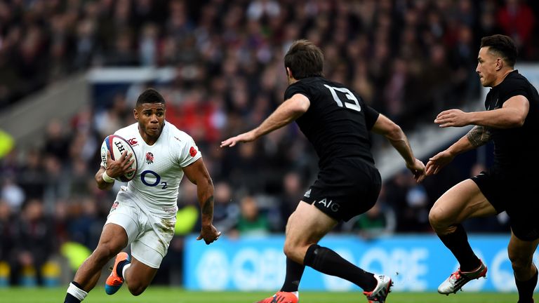 Kyle Eastmond of England takes on the New Zealand defence