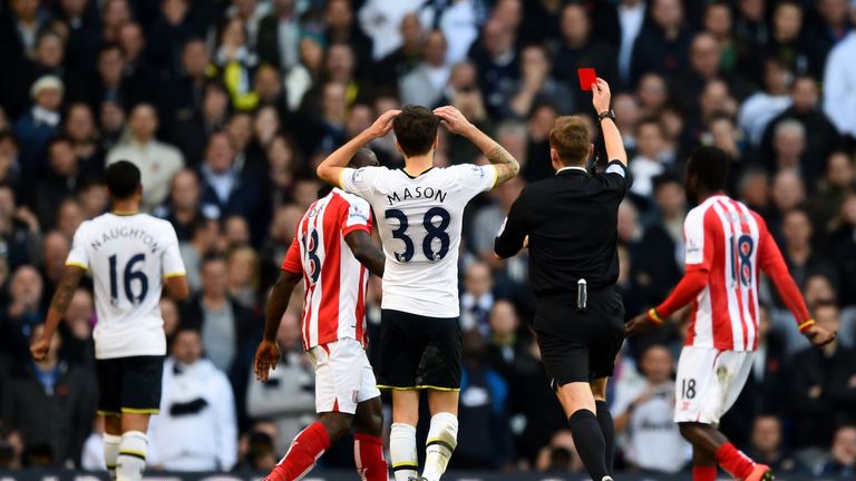 LONDON, ENGLAND - NOVEMBER 09:  Referee Mike Jones shows the red card to Kyle Naughton #16 (L) of Spurs during the Barclays Premier League with Stoke City