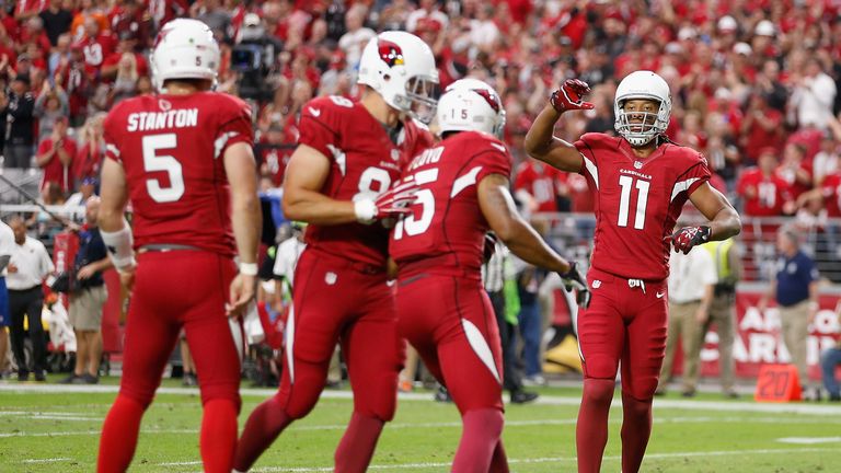Wide receiver Larry Fitzgerald of the Arizona Cardinals congratulates wide receiver Michael Floyd