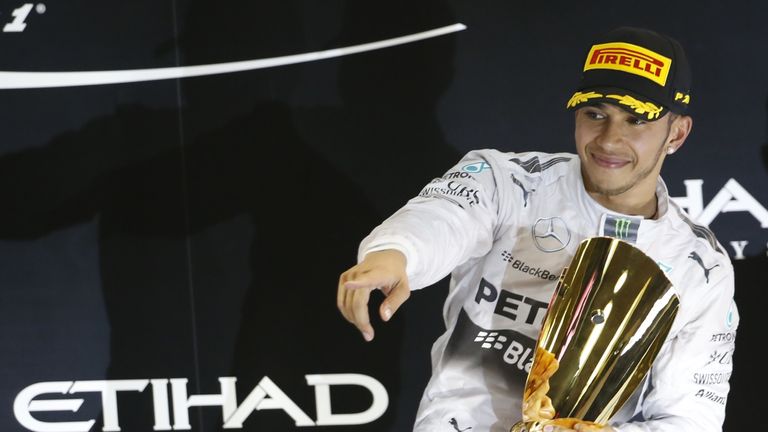 Lewis Hamilton celebrates on the podium