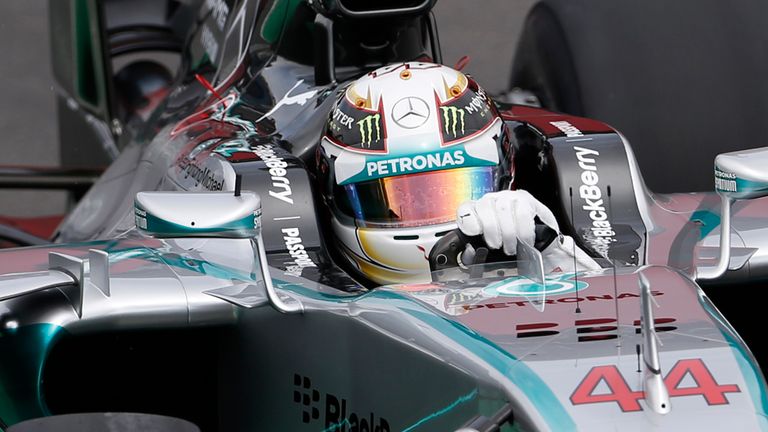 Mercedes driver Lewis Hamilton, of Britain, steers his car on the pit lane during a free practice for the Formula One Brazilian Grand Prix