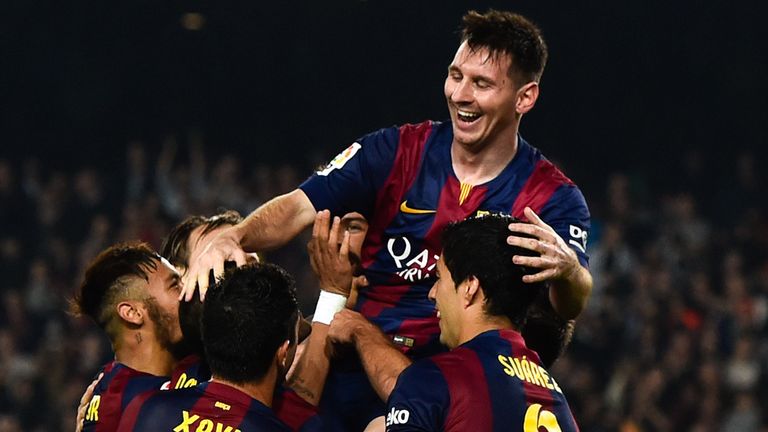 Lionel Messi celebrates after scoring his team's fourth goal against Sevilla