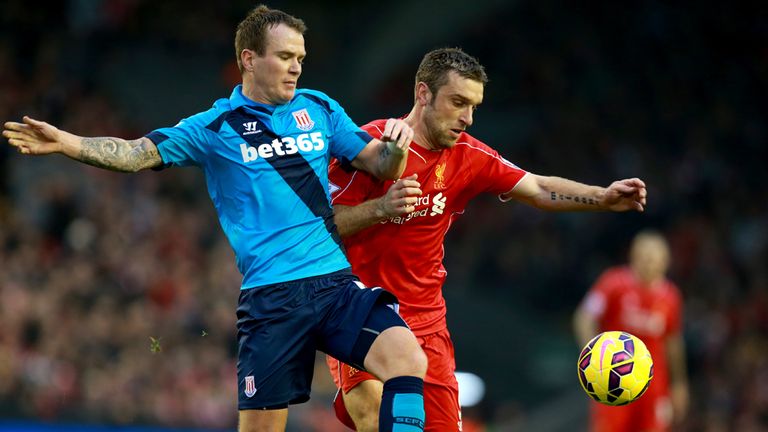 Liverpool's Rickie Lambert (right) and Stoke City's Glen Whelan (left) battle for the ball during the Barclays Premier League match at Anfield, Liverpool.