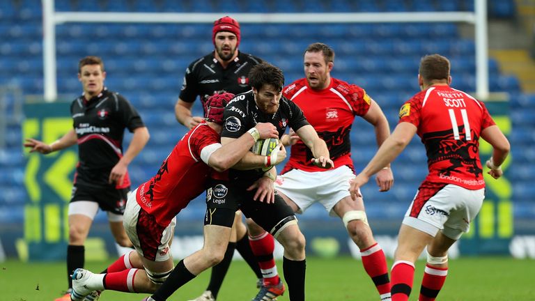 OXFORD, ENGLAND - NOVEMBER 09:  Shane Monahan of Gloucester is tackled by James Down of London Welsh during the LV= Cup match between London Welsh and Glou