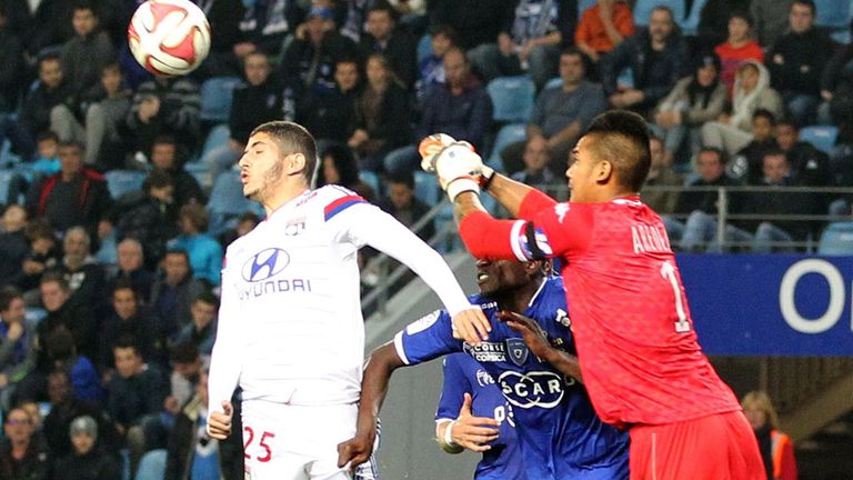 Bastia goalkeeper Alphonse Areola vies with Lyon's Yassine Benzia 