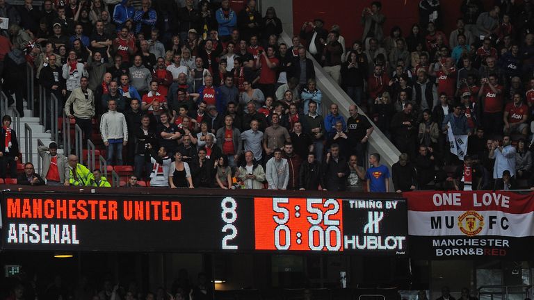 The scoreboard displays the 8-2 score-line during the English Premier League football match between Manchester United and Arsenal at Old Trafford in Manche