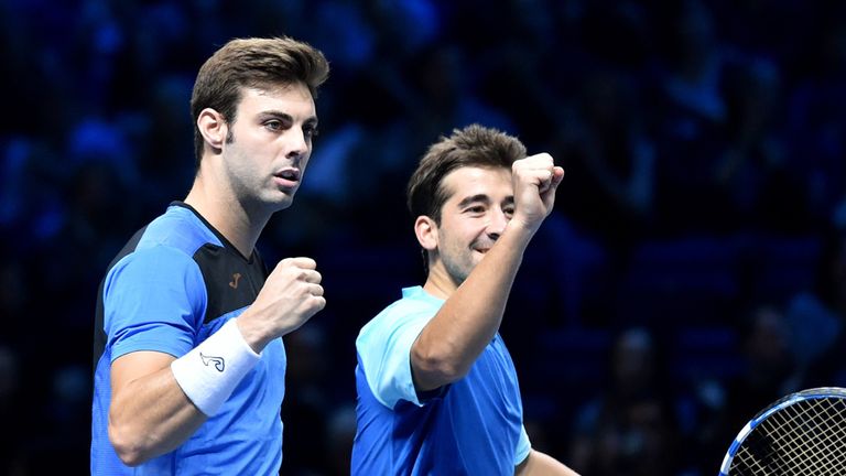 Spain's  Marc Lopez (R) and Spain's Marcel Granollers celebrate winning the group B doubles match against 