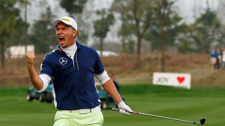Marcel Siem of Germany celebrates his chip in on the first playoff hole of the BMW Masters