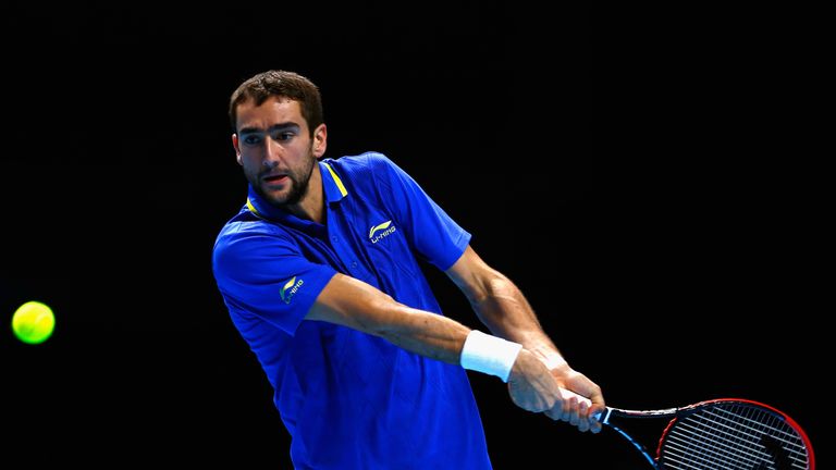 Marin Cilic plays a backhand in the round robin singles match against Stan Wawrinka of Switzerland at the ATP World Tour Finals