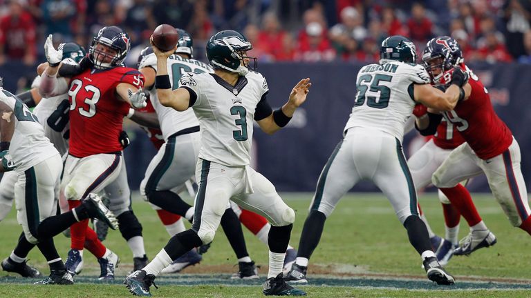 Mark Sanchez #3 of the Philadelphia Eagles looks for a receiver against the Houston Texans