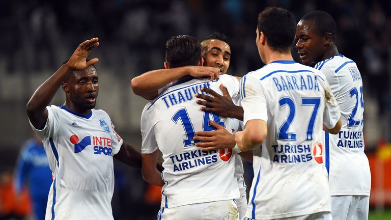 Marseille's Florian Thauvin (C) celebrates with teammates (From L) Brice Dja Djedje, Dimitri Payet, Abdelaziz Barrada and Giannelli Imbula