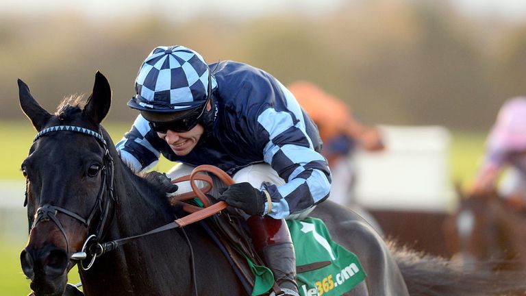 WETHERBY, ENGLAND - NOVEMBER 01:  Richard Johnson riding Menorah clear the last to win The bet365 Charlie Hall Steeple Chase at Wetherby racecourse.