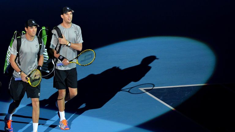 Mike Bryan and Bob Bryan of the US arrive to play their doubles match against Horia Tecau and Jean-Julien Rojer  on day four of the ATP World Tour Finals