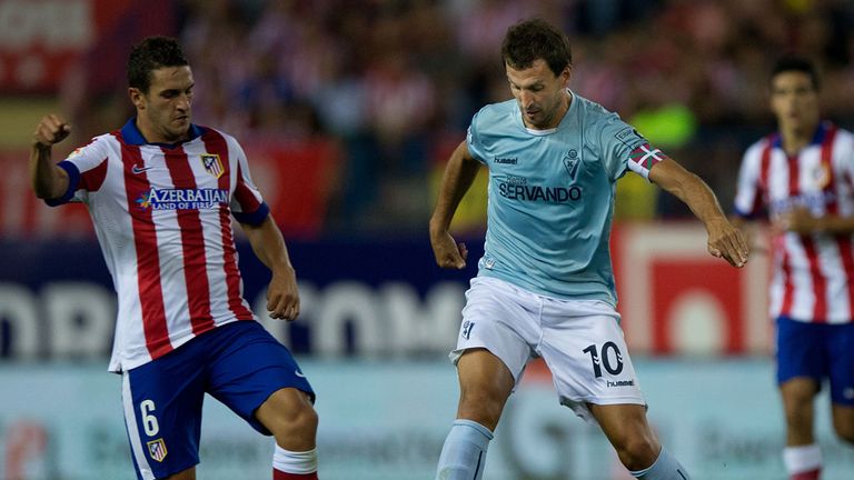 MADRID, SPAIN - AUGUST 30: Captain Mikel Arruabarrena (R) Arambide of SD Eibar competes for the ball with Koke L) of Atletico de Madrid during the La Liga 