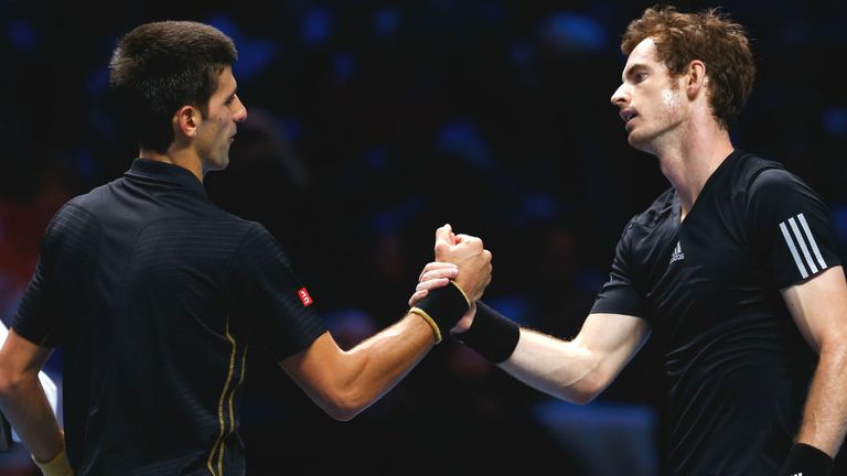Novak Djokovic shakes hands with Andy Murray after the exhibition match at the ATP World Tour Finals at O2 Arena