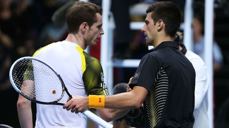 Andy Murray shakes hands with Novak Djokovic following his defeat during the ATP World Tour Finals 2012