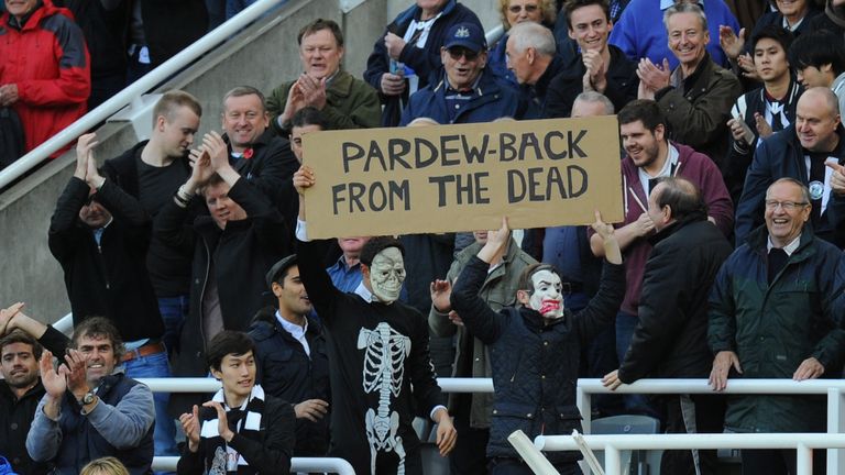 Newcastle fans display a sign in favour of manager Alan Pardew after the 1-0 win over Liverpool.