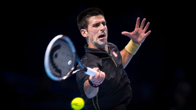 Novak Djokovic of Serbia plays a forehand in the round robin singles match against Stan Wawrinka of Switzerland at the ATP World Tour Finals in London