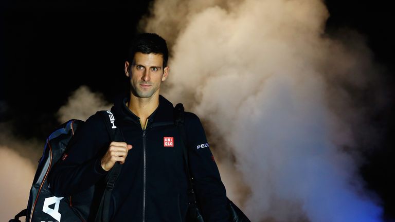 Novak Djokovic enters the court for the round robin singles match against Tomas Berdych at the ATP World Tour Finals at the O2 Arena