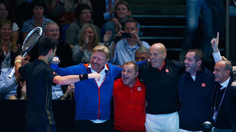 Novak Djokovic celebrates victory with his coaching staff after clinching the world No 1 ranking at the ATP World Tour Finals