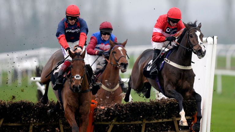 Old Guard (left) jumps the last ahead of Mick Jazz