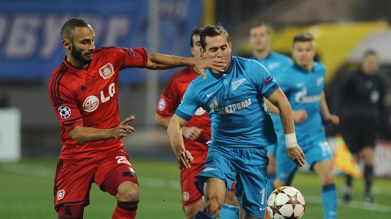 Omer Toprak (R) fights for a ball with Yuri Lodygin of Zenit St. Petersburg 