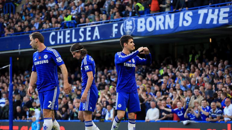 Chelsea's Oscar (right) celebrates scoring the opening goal during the Barclays Premier League match against QPR at Stamford Bridge, London.