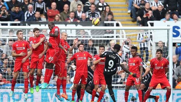 Papiss Cisse takes a free kick during the Premier League match between Newcastle and Liverpool.