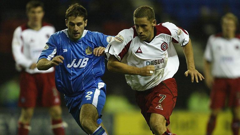 Michael Brown of Sheffield United beats Paul Mitchell of Wigan Athletic during the Nationwide First Division match on 21 October 2003